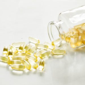 from a glass jar scattered yellow capsules medicine food additive vitamin d capsules fish oil sun t20 yXKayO